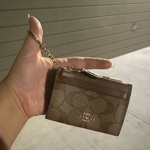 Coach mini skinny id case in signature canvas gold/khaki saddle 2. Lightly worn